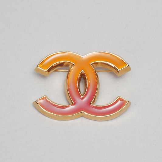 Broche CHANEL doré / rouge / bordeaux