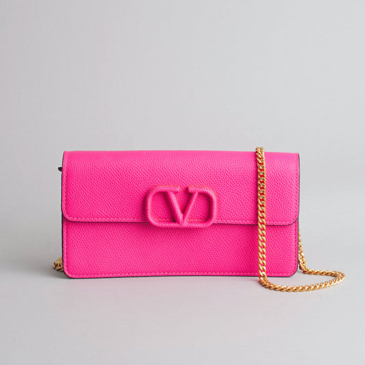 VALENTINO GARAVANI — Pochette VLogo en cuir rose fuchsia franc