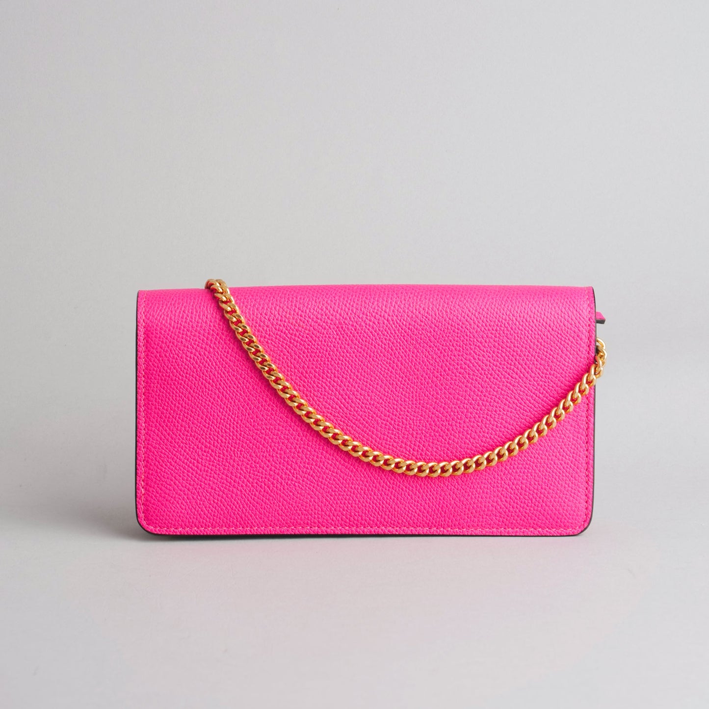 VALENTINO GARAVANI — Pochette VLogo en cuir rose fuchsia franc