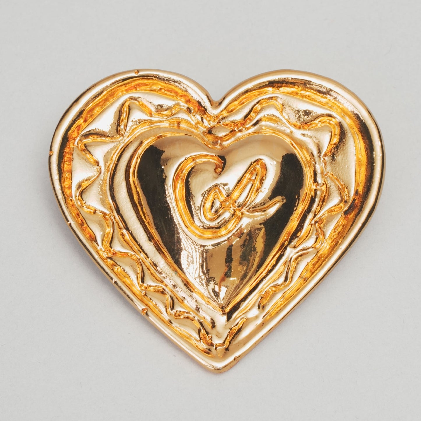 Broche cœur  CHRISTIAN LACROIX doré