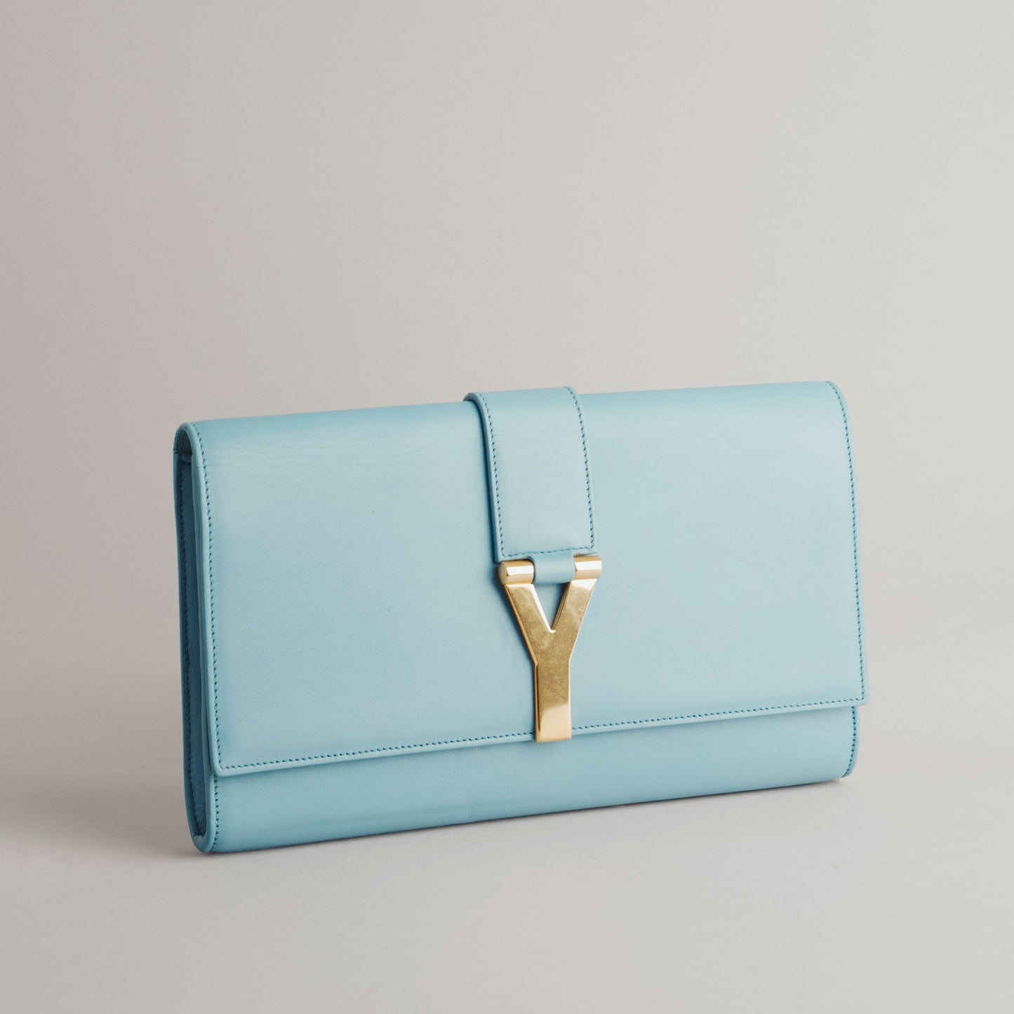 SAINT LAURENT — Pochette en cuir bleu