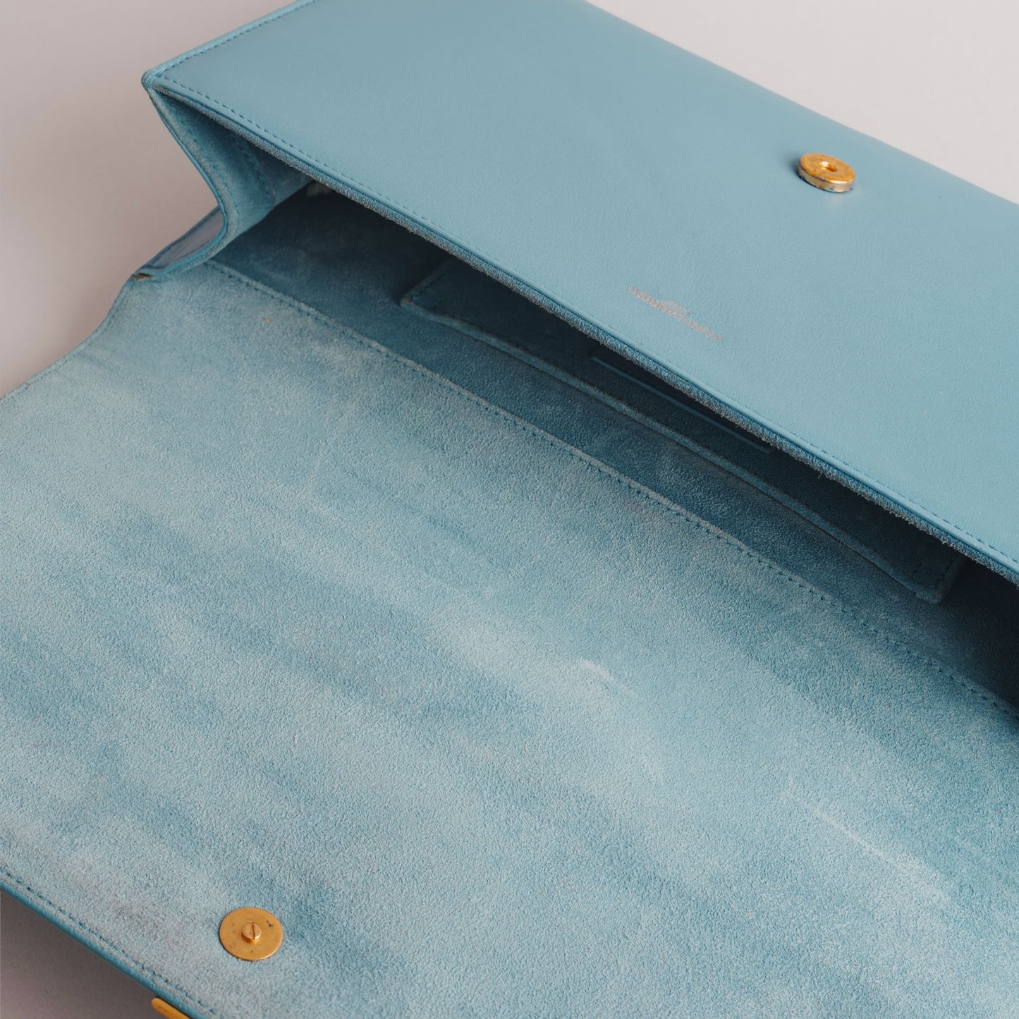SAINT LAURENT — Pochette en cuir bleu